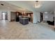 Open-concept living space featuring modern tile floors, stylish lighting, and seamless flow to the kitchen at 6780 N Michigan Rd, Fairland, IN 46126