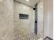 Modern walk-in shower with designer tile and black fixtures at 6780 N Michigan Rd, Fairland, IN 46126