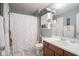 Well-lit bathroom featuring a shower with curtain, vanity, and coordinated decor at 7031 Sea Eagle Ct, Indianapolis, IN 46254