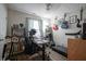 Office space with a treadmill, guitars, and a large desk at 7031 Sea Eagle Ct, Indianapolis, IN 46254