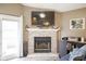 Close-up of the living room fireplace with white mantle and mounted television at 7031 Sea Eagle Ct, Indianapolis, IN 46254
