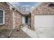 Charming home exterior featuring a brick facade, attached garage, and well-maintained landscaping at 7031 Sea Eagle Ct, Indianapolis, IN 46254