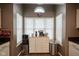 Bright kitchen with a cozy coffee bar area illuminated by a large window at 7031 Sea Eagle Ct, Indianapolis, IN 46254