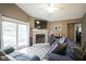 Inviting living room with a brick fireplace, modern furnishings, and ample natural light at 7031 Sea Eagle Ct, Indianapolis, IN 46254
