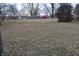 Large fenced-in backyard with an open grass area at 7144 Sandalwood Dr, Indianapolis, IN 46217