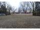 Spacious backyard featuring a tall fence for privacy at 7144 Sandalwood Dr, Indianapolis, IN 46217