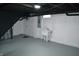 Unfinished basement featuring a laundry sink and electrical panel at 7144 Sandalwood Dr, Indianapolis, IN 46217