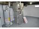 Water heater and furnace in the unfinished basement of this house at 7144 Sandalwood Dr, Indianapolis, IN 46217