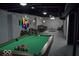 Finished basement with a billiards table and sitting area with grey couches at 7144 Sandalwood Dr, Indianapolis, IN 46217