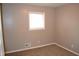 Neutral bedroom with window, wall heater, and white trim at 7144 Sandalwood Dr, Indianapolis, IN 46217