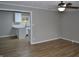Living room featuring wood flooring and ceiling fan with light at 7144 Sandalwood Dr, Indianapolis, IN 46217