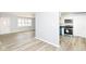 Bright living room connected to kitchen with lots of natural light and modern flooring at 8230 E 12Th St, Indianapolis, IN 46219