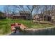 Backyard view of a home with large deck, lake access and dock at 895 Baywood Ct, Columbus, IN 47201