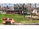 Backyard with kayaks, pond access, and a charming lawn leading to the main house at 895 Baywood Ct, Columbus, IN 47201