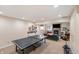 Spacious basement with a fireplace, ping pong table and comfortable seating area at 895 Baywood Ct, Columbus, IN 47201