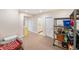 Unfinished basement area with storage shelves and access to utilities and the bathroom at 895 Baywood Ct, Columbus, IN 47201