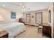 Cozy bedroom with warm neutral tones, wooden blinds, and comfortable furnishings at 895 Baywood Ct, Columbus, IN 47201