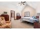 Comfortable bedroom with a vaulted ceiling, a ceiling fan, and classic wooden furniture at 895 Baywood Ct, Columbus, IN 47201