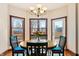 Cozy breakfast nook with a chandelier and large windows offering a backyard view at 895 Baywood Ct, Columbus, IN 47201