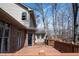 Expansive wooden deck perfect for entertaining and enjoying the wooded scenery of this lovely home at 895 Baywood Ct, Columbus, IN 47201