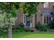 Close-up of home's entrance showcasing a blue door with wreath and brick steps at 895 Baywood Ct, Columbus, IN 47201