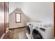 Convenient laundry room features modern appliances and a window for natural light at 895 Baywood Ct, Columbus, IN 47201