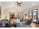 Bright living room with vaulted ceilings, wood floors, and an open layout to the kitchen and dining area at 895 Baywood Ct, Columbus, IN 47201