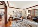 Comfortable living room with hardwood floors, a fireplace and large windows at 895 Baywood Ct, Columbus, IN 47201
