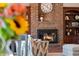 Inviting living room showcases a brick fireplace with built-in shelving and a cozy armchair at 895 Baywood Ct, Columbus, IN 47201