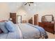 Serene bedroom with a bed, a vaulted ceiling, and wooden furniture at 895 Baywood Ct, Columbus, IN 47201