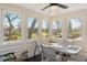 Bright sunroom with multiple windows offering views of the backyard and lake at 895 Baywood Ct, Columbus, IN 47201