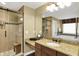 Modern bathroom featuring granite counters, a glass enclosed shower, and beautiful tile work at 9643 N Box Elder Ct, McCordsville, IN 46055