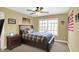 Bedroom features wood bed frame, ceiling fan and window providing natural light at 9643 N Box Elder Ct, McCordsville, IN 46055