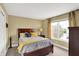 Bedroom featuring a wood bed frame, neutral wall color, carpet, and natural light from a bright window at 9643 N Box Elder Ct, McCordsville, IN 46055