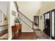 Spacious foyer featuring a staircase, hardwood floors, and natural light and entry to living area at 9643 N Box Elder Ct, McCordsville, IN 46055