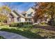 Beautiful two-story home featuring stone and brick accents, green trim, and a well-manicured lawn at 9643 N Box Elder Ct, McCordsville, IN 46055