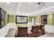 Home theater with tiered seating featuring leather reclining chairs, projector, and recessed lighting at 9643 N Box Elder Ct, McCordsville, IN 46055