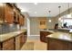A close-up of a kitchen that has wooden cabinets, stainless steel appliances, and tiled backsplash at 9643 N Box Elder Ct, McCordsville, IN 46055