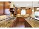 Elegant kitchen with granite countertops, custom cabinets, and stainless steel sink at 9643 N Box Elder Ct, McCordsville, IN 46055