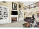 Cozy living room with fireplace, built-in bookshelves, and plush seating at 9643 N Box Elder Ct, McCordsville, IN 46055