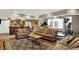 Comfortable living room with a brick bar and a fitness area; perfect for relaxing and entertaining at 9643 N Box Elder Ct, McCordsville, IN 46055