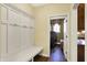 Mudroom with built in bench, storage, and coat rack at 9643 N Box Elder Ct, McCordsville, IN 46055