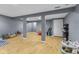 Finished basement area with laminate flooring and grey walls at 10441 Alexia Dr, Indianapolis, IN 46236