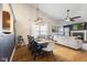 Open-concept dining area features a large dining table and views of the living room at 10441 Alexia Dr, Indianapolis, IN 46236