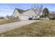 Ranch style house with a two car garage and a concrete driveway at 10441 Alexia Dr, Indianapolis, IN 46236