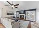 Comfortable living room with fireplace, wooden floors, and a big sectional at 10441 Alexia Dr, Indianapolis, IN 46236