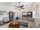Spacious living room with a large sectional couch and seamless view to the dining area at 10441 Alexia Dr, Indianapolis, IN 46236