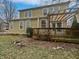 View of the backyard featuring a two-story home with a wooden deck and pergola at 11134 Westoves Dr, Noblesville, IN 46060