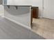 Basement bar area with a countertop, cabinets, and tiled flooring at 11134 Westoves Dr, Noblesville, IN 46060