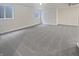 Finished basement with two windows offering natural light and neutral carpet at 11134 Westoves Dr, Noblesville, IN 46060